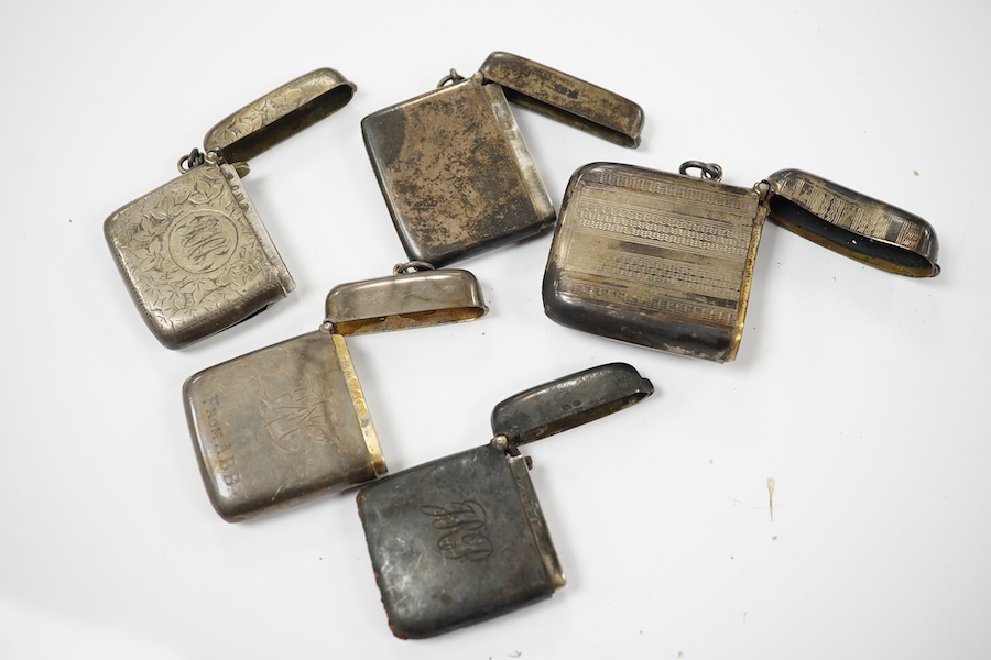 Five assorted late 19th/early 20th century silver vesta cases, largest 58mm. Condition - poor to fair